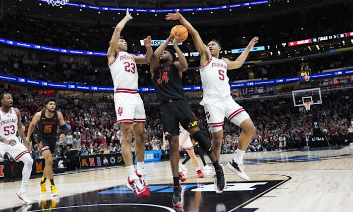 Trayce Jackson-Davis (23) and defend Maryland Terrapins forward Donta Scott (24) forward Malik Reneau (5) during the second half at United Center.